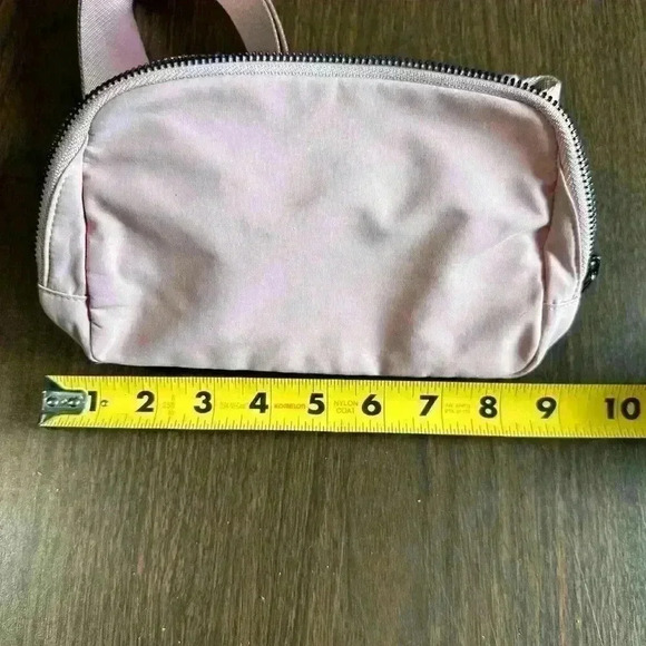 Light Pink Fanny Bag. Zip Closure. Pockets. Adjustable. 5”x9”. - Picture 6 of 8